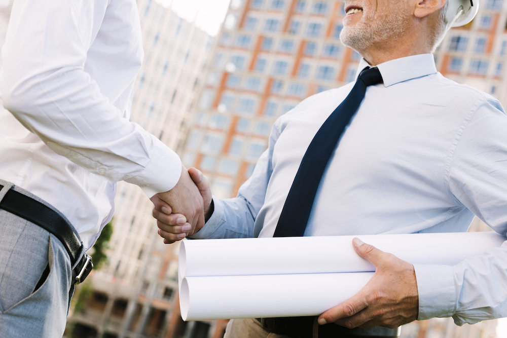 low-angle-men-shaking-hands