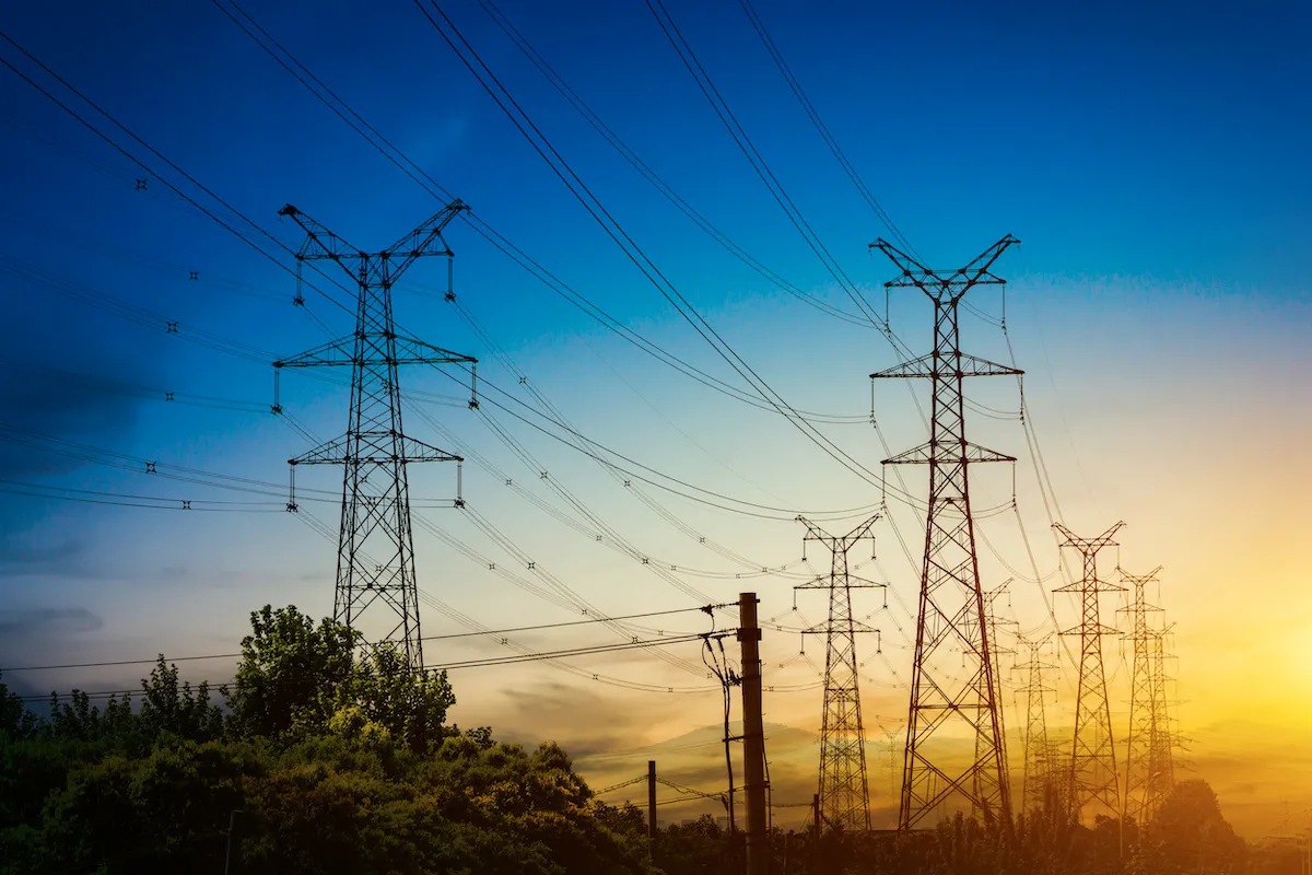 sun-setting-silhouette-electricity-pylons